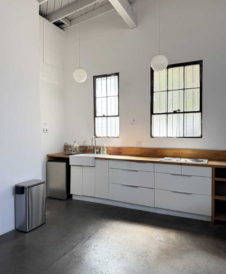 Studio kitchenette with sink and counter space